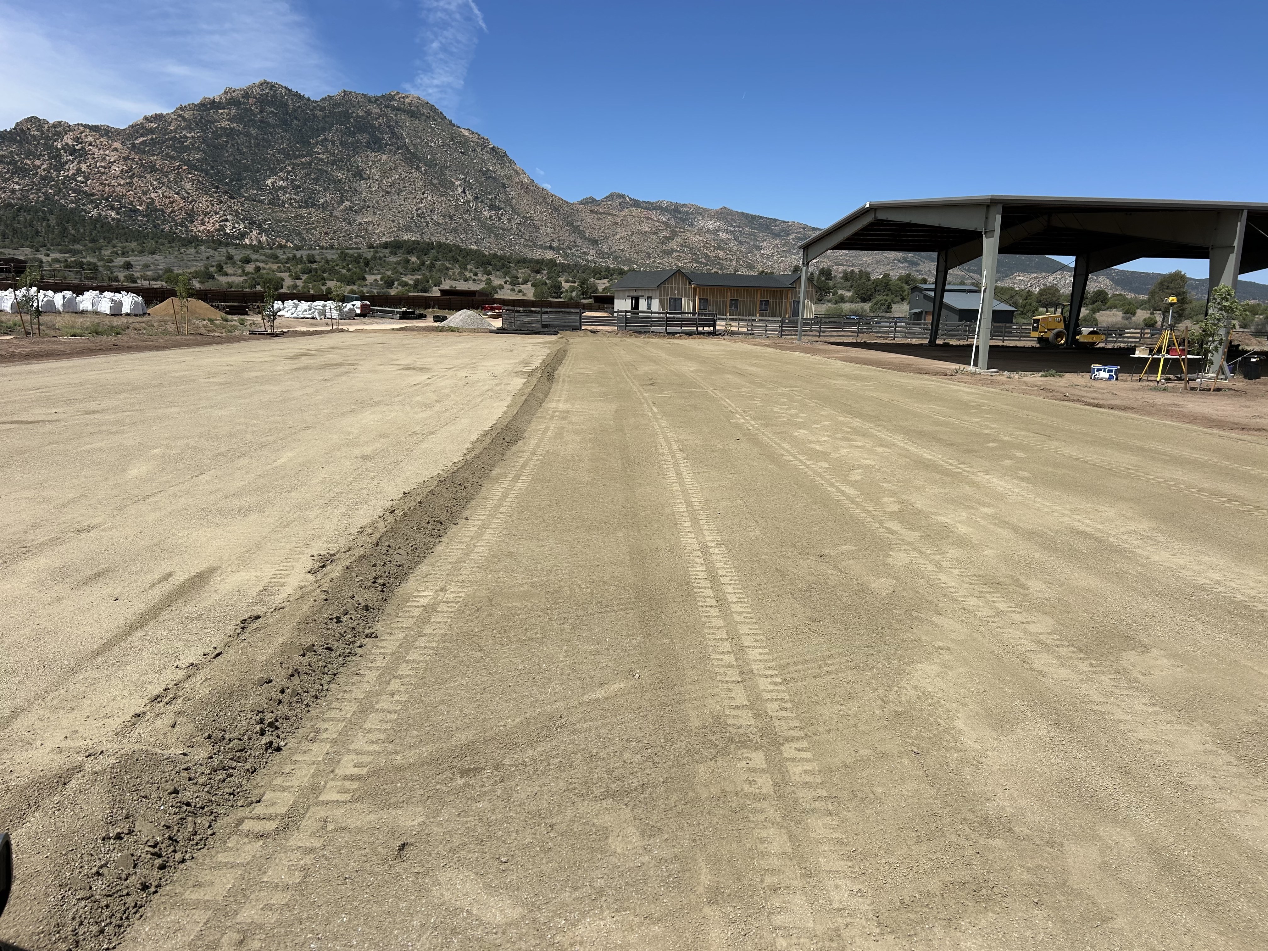 Arena footing being spread and graded