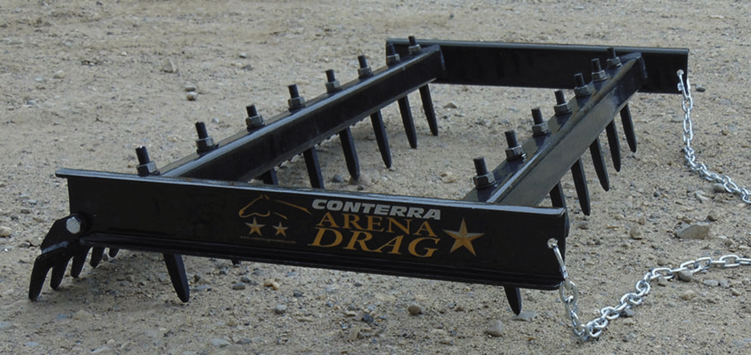 A sand arena featuring an Arena Drag and two different types of rakes.