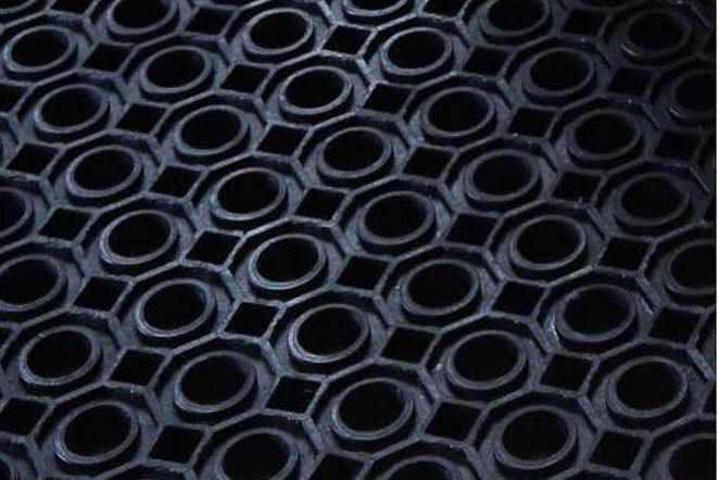 Hexagon hollow drainage cells on the underside of a PF Rubber BaseMat