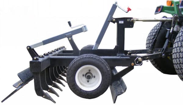 Arena Max hooked to a 3-point hitch tractor — side view
