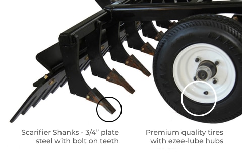 Arena Rake attached to a tractor with wheel and depth control system visible
