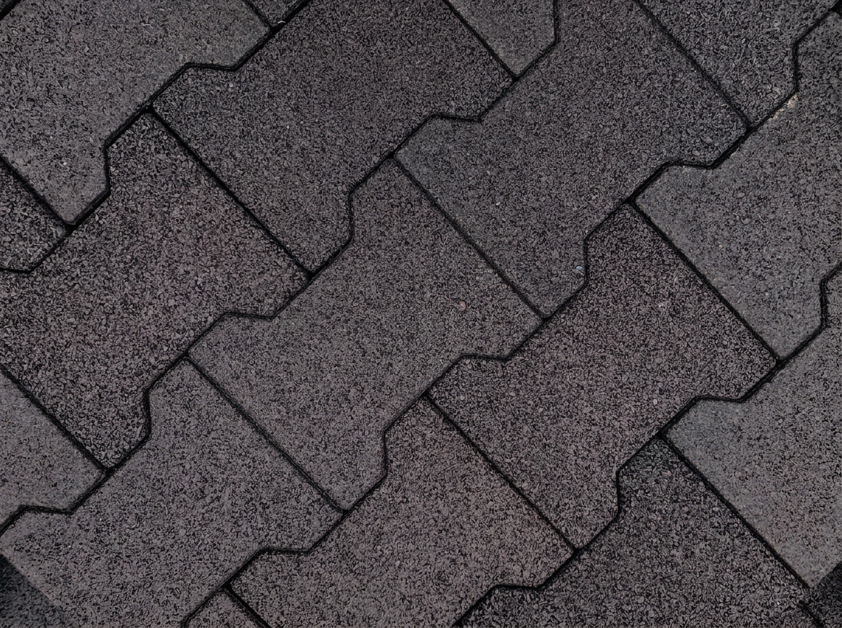 Interlocking black dog-bone rubber pavers