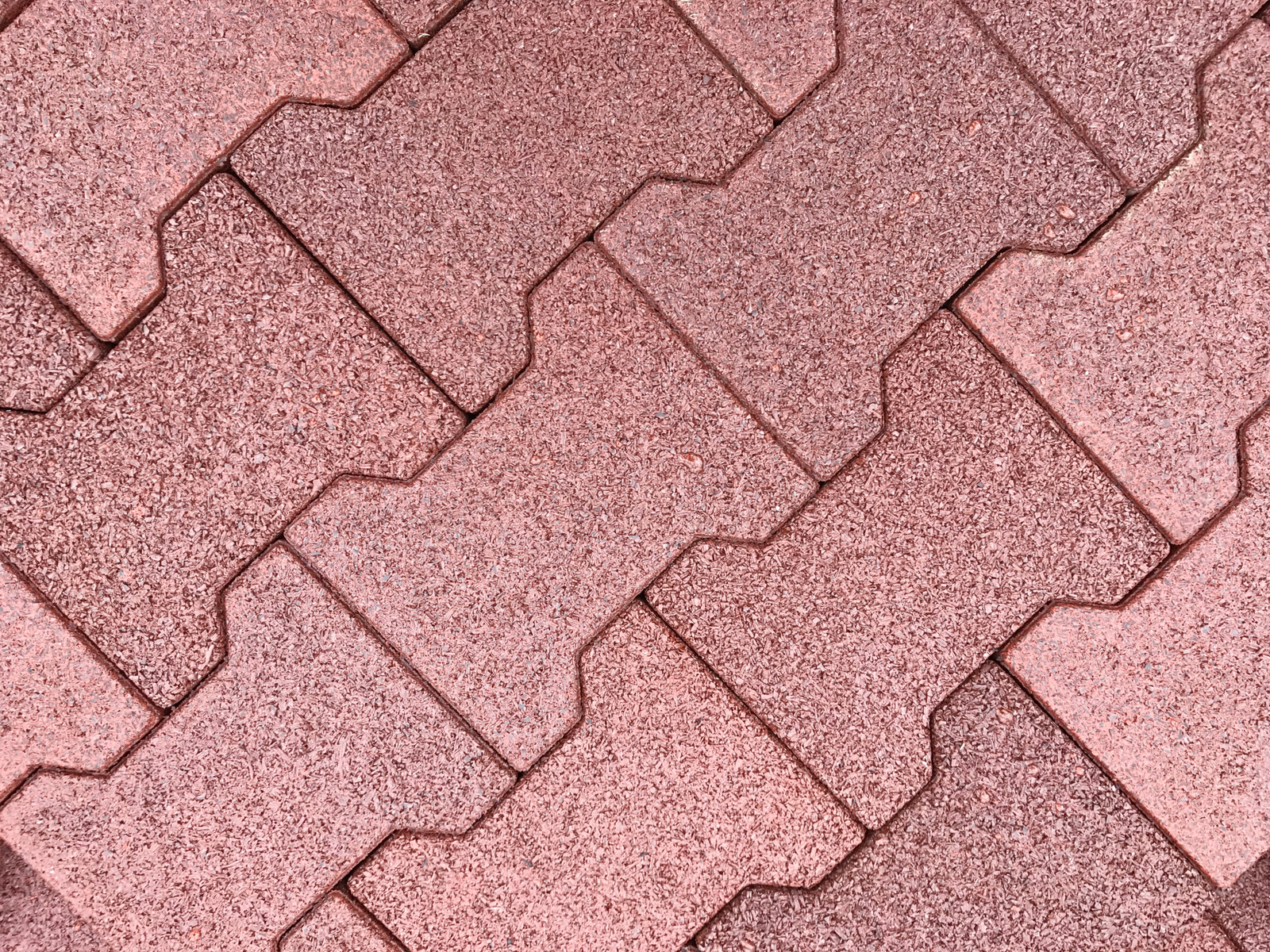 Brick red rubber pavers installed as equestrian flooring