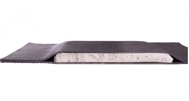 Cutaway view of Stall Mattress showing closed-cell foam core sealed between vulcanized rubber
