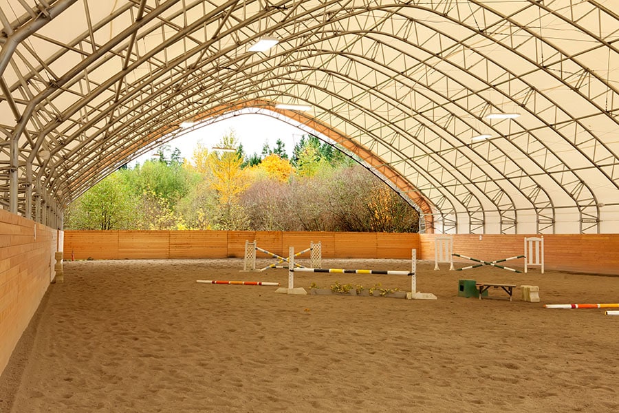 How Much Does it Cost to Build a Horse Arena? | Performance Footing