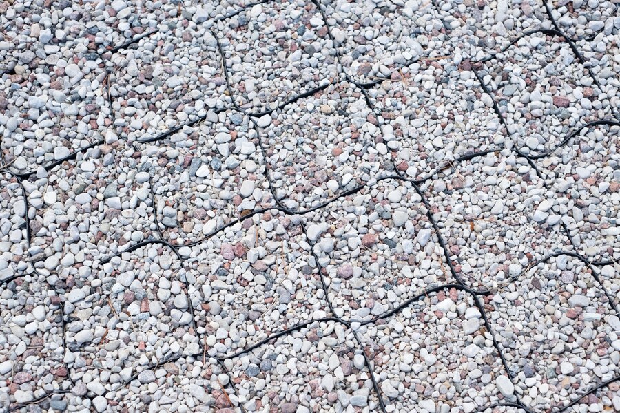 A close up image of a gravel road enhanced with geocells.