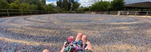 A person's hand holding a bunch of colorful beads.