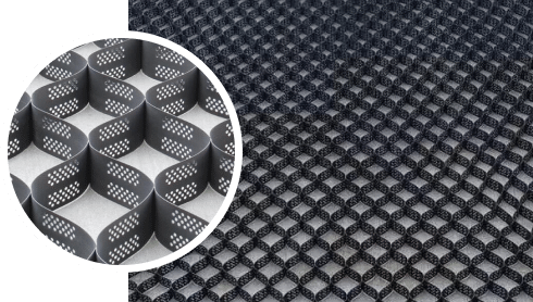 A picture of a black mesh with a pattern on it, showcasing innovative Arena Footing Solutions.