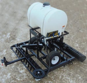 A black and white tractor with a water tank on it, equipped with Water Kits EG.