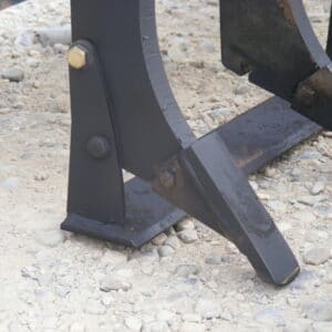 A close up of a black metal plow featuring a Profiler Bar.