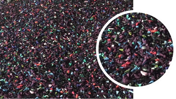A pile of colored sand with a circle in the middle.