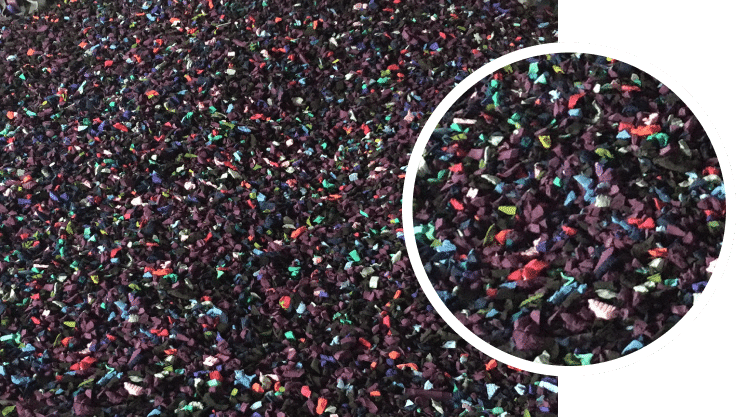 A pile of colored sand with a circle in the middle. A pile of colored sand with a circle in the middle.