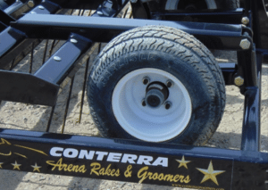 A Synergy tire adorned with a star, sitting in the Synergy Arena.