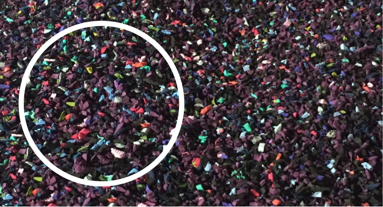 A colorful pile of confetti surrounding a circle.