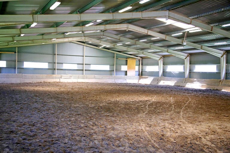 Building a Horse Arena on a Budget Performance Footing