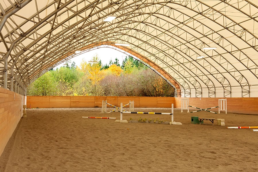How Much Does It Cost to Build a Horse Arena | Performance Footing