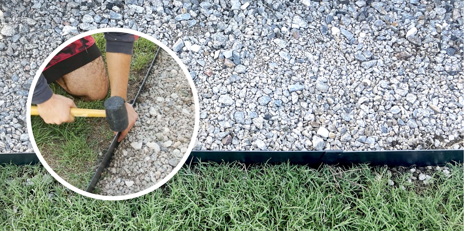 A man is laying down a plastic liner on a grassy area.