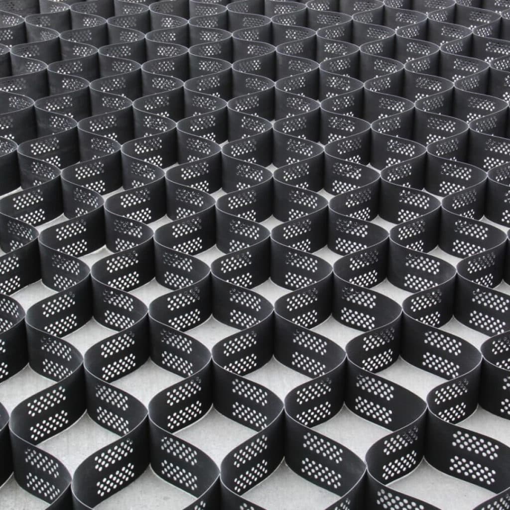 A close up of a 3” BaseCore™ Geocell grid of holes.
