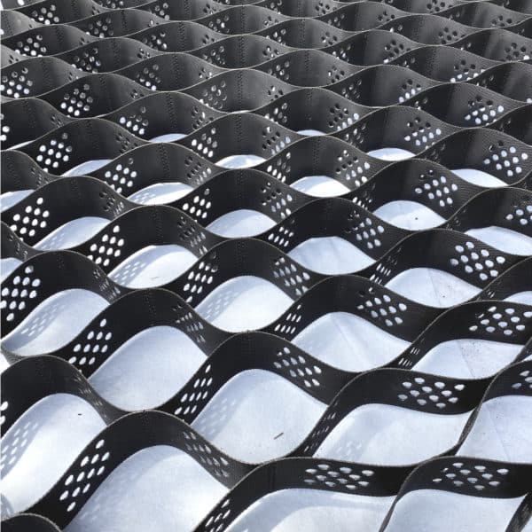 A close up of a black mesh with holes in it.