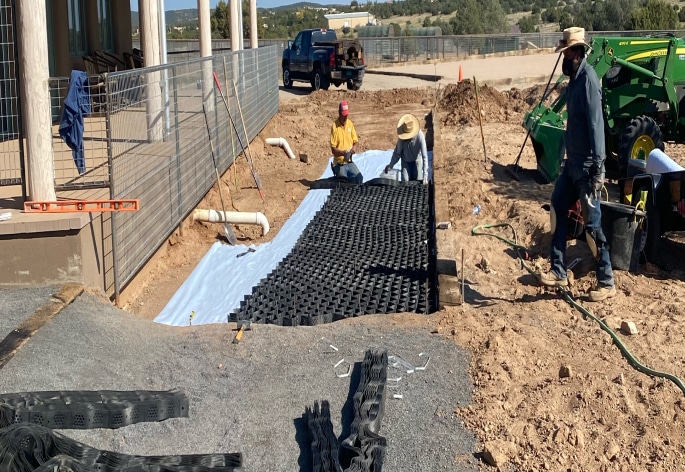 A group of people working on a construction site.