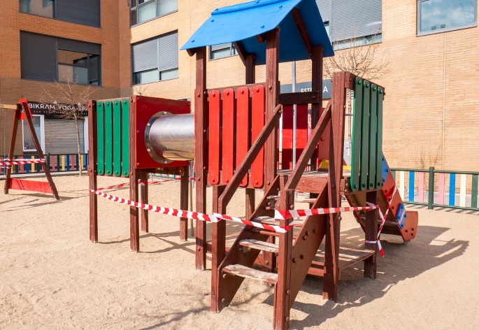 Playground closed with red and white tape