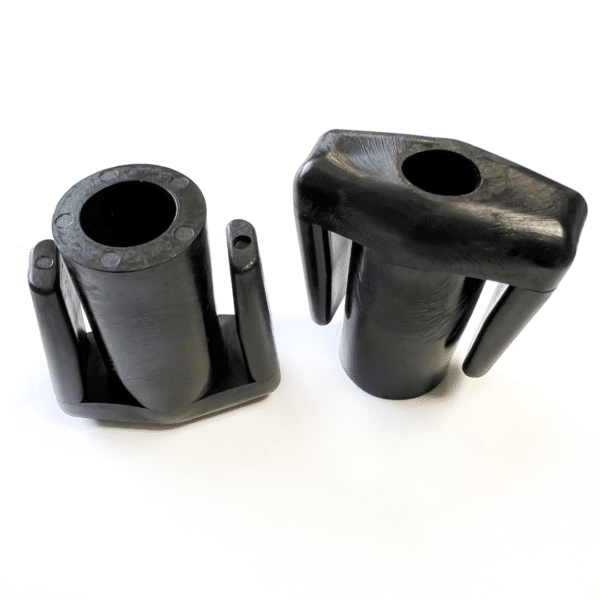 Two black plastic cylinders on a white surface, packaged in a pack of 12 BaseCaps (Pack of 12 ).